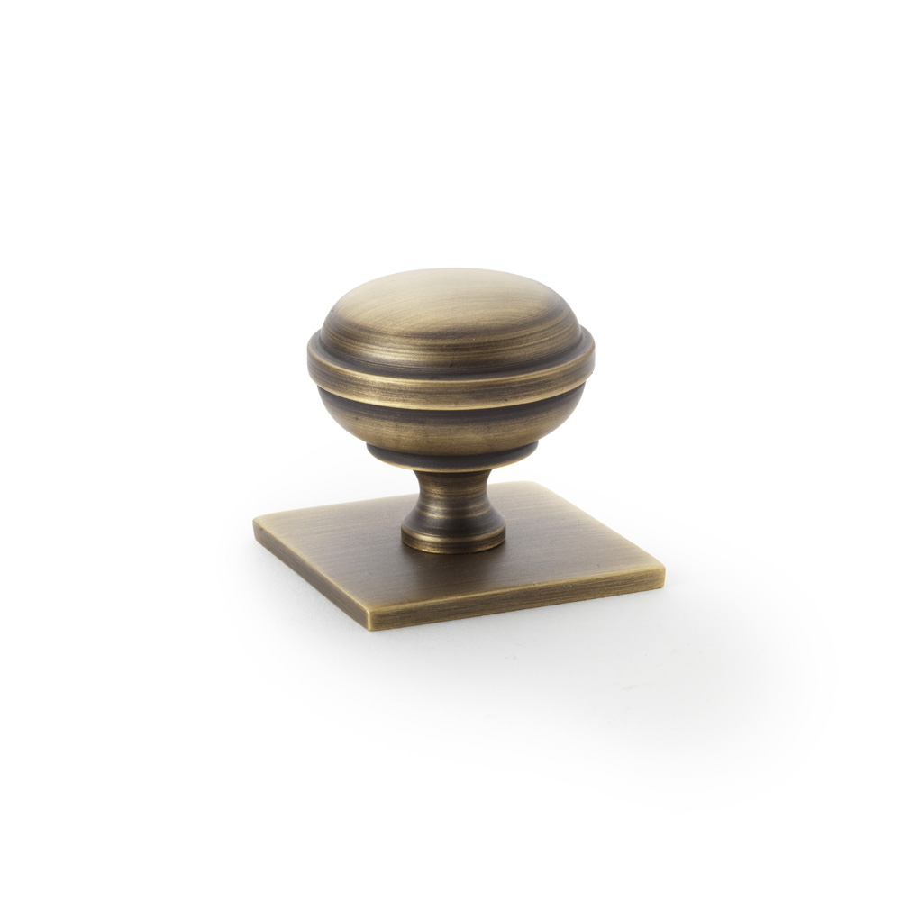 Alexander & Wilks Quantock Cupboard Knob on Square Backplate - Antique Brass - 34mm